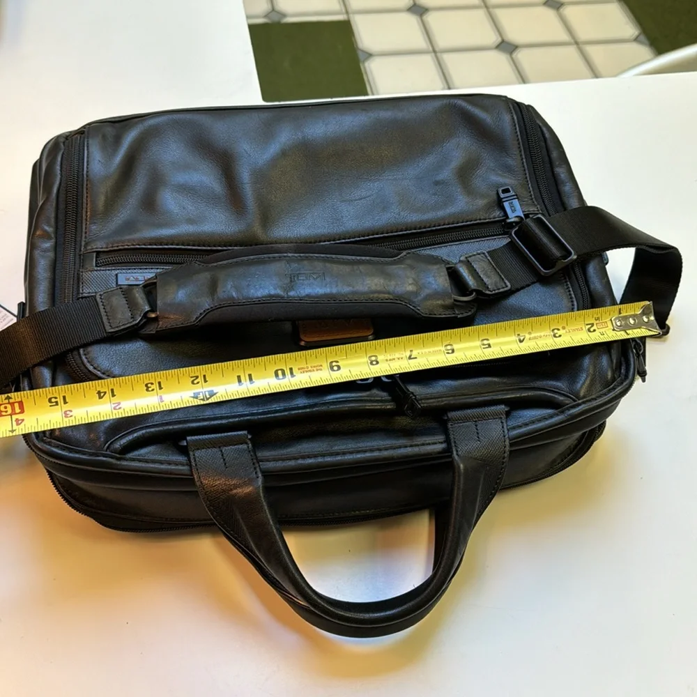 TUMi black leather computer briefcase carry-on VGC long strap multiple pockets